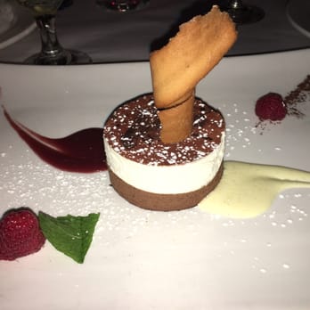Chez Joel Bistro - Chocolate mousse. Almost like a tiramisu texture and the whole sauce is delicious! - French Near Me - Chicago, Illinois