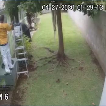 Oahu Pro Painters - Standing on my A/C unit - Painters Near Me - Aiea, Hawaii