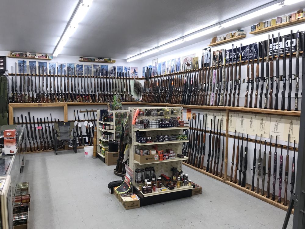 Corner Store Restaurant & Gun Shop Logo