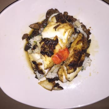 Bonefish Grill - Chilean Sea Bass with Misoyaki marinade, pickled ginger relish on a bed of sautéed spinach, mushrooms, and jasmine rice. - Seafood Near Me - Omaha, Nebraska