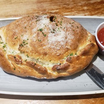Picasso's - Spinach and Cheese Calzone - Pizza Near Me - Jacksonville, Florida Picasso's - Spinach and Cheese Calzone - Pizza Near Me - Jacksonville, Florida
