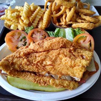Clambake Seafood Restaurant - "Jaws Burger" Haddock Club Sandwich with lettuce, tomato, cheese, and bacon. - Seafood Near Me - Scarborough, Maine