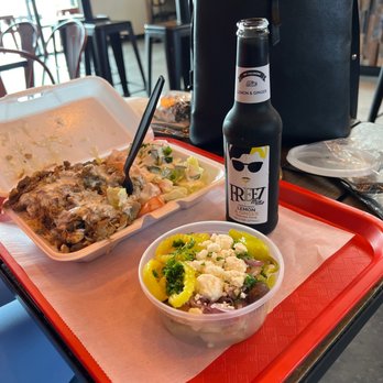 Halal Street Food - Combo over rice, Greek Salad and Freeze lemon&ginger drink. - Mediterranean Near Me - Charlotte, North Carolina Halal Street Food - Combo over rice, Greek Salad and Freeze lemon&ginger drink. - Mediterranean Near Me - Charlotte, North Carolina