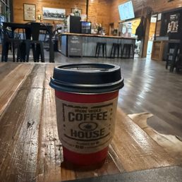 Small hot latte relaxing on a Saturday morning. Small hot latte relaxing on a Saturday morning.