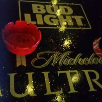 Linda's Lounge - a bud light logo on a table - Dive Bars Near Me - Lake Charles, Louisiana