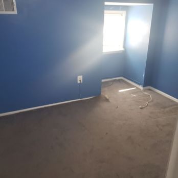 Professional Carpet Systems - empty room with blue walls - Carpeting Near Me