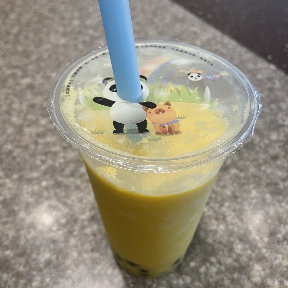 a plastic cup with a blue straw a plastic cup with a blue straw