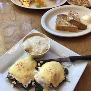 Mulberry Lane Cafe - Greek Eggs Benedict with their AMAZING grits. One slice French Toast. Ham and cheese omelet with grits and hash browns - Breakfast & Brunch Near Me - Melbourne, Florida Mulberry Lane Cafe - Greek Eggs Benedict with their AMAZING grits. One slice French Toast. Ham and cheese omelet with grits and hash browns - Breakfast & Brunch Near Me - Melbourne, Florida