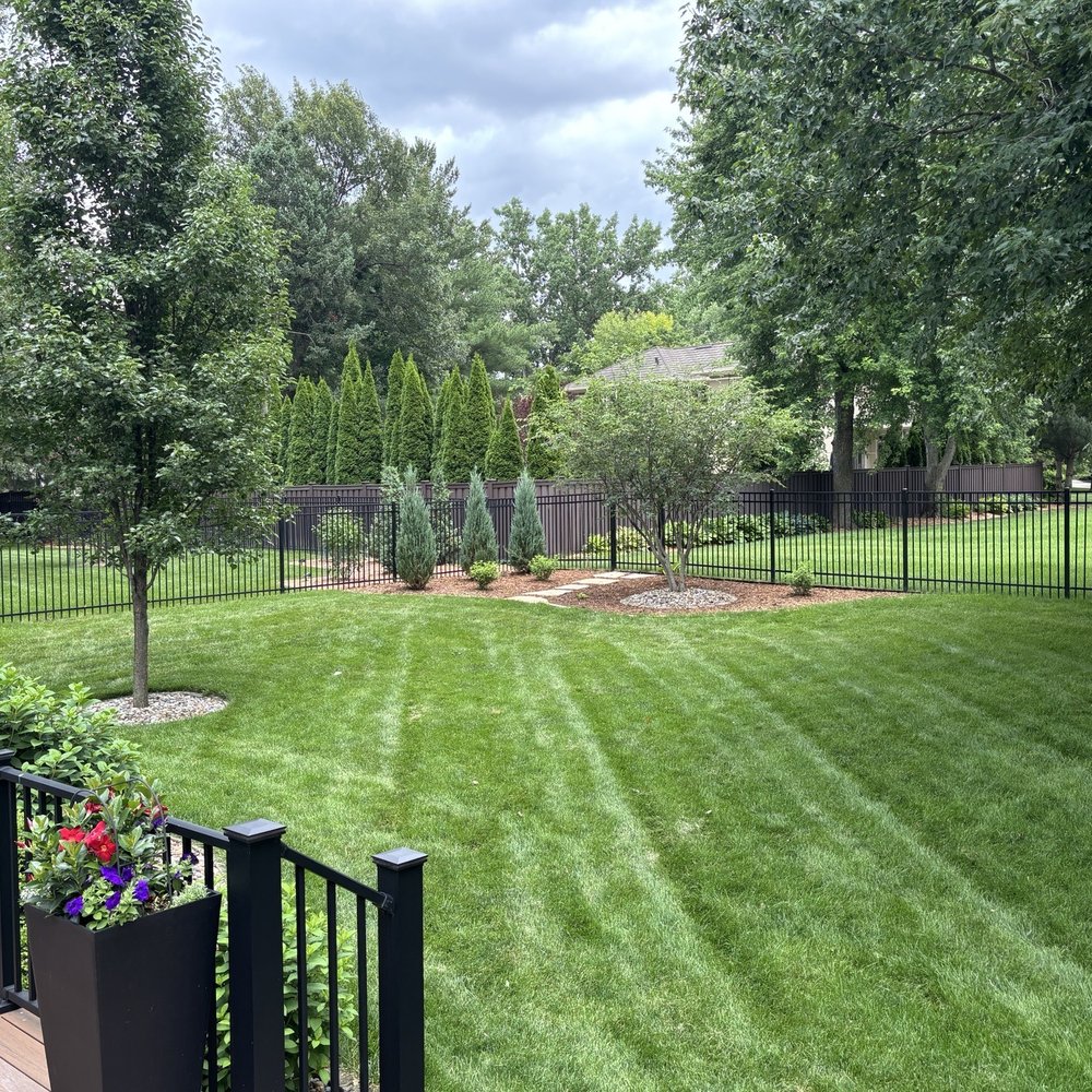 Miller Nursery - Fixed corner mowing area with landscaping. Rounded the approach to the landscaping to the right. - Nurseries & Gardening Near Me - Johnston, Iowa