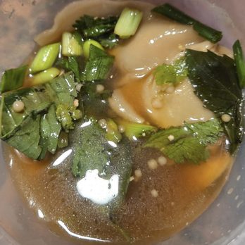 True Food Kitchen - Edamame Dumplings with white truffle oil, dashi, thai basil, sesame seeds - New American Near Me - Reston, Virginia