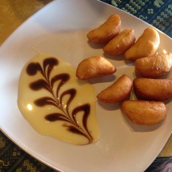 Rock A Bangkok - Thai donuts with condensed milk and chocolate on the side. - Thai Near Me - Miami, Florida Rock A Bangkok - Thai donuts with condensed milk and chocolate on the side. - Thai Near Me - Miami, Florida