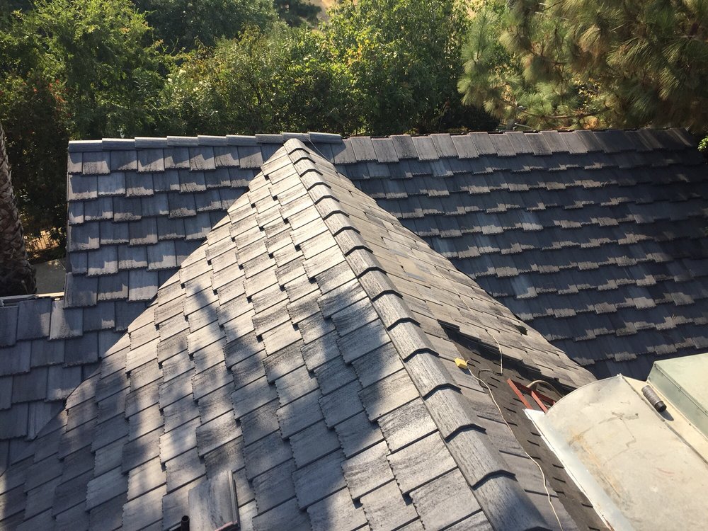 Slide of Woolf Roofing