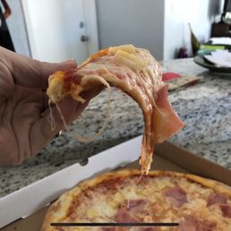 Garbage floppy pizza. Can't even eat it like regular pizza bc it's so soggy and greasy.