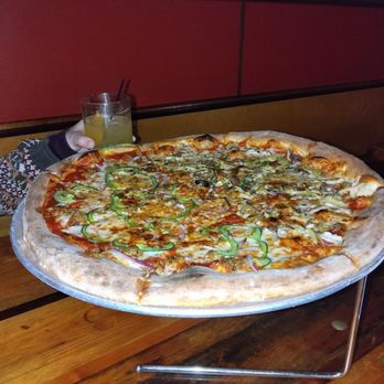 Pizza J - 1/2 Arcimboldo and 1/2 Strutter (and a bicycle operator cocktail in the background) - Pizza Near Me - Providence, Rhode Island