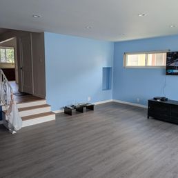 New floor, stairs and painted living room. New floor, stairs and painted living room.