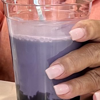 First Light Coffee and Juice Bar - Barista is mixing my Ube Oat milk Latte - Bakeries Near Me - Kapaa, Hawaii