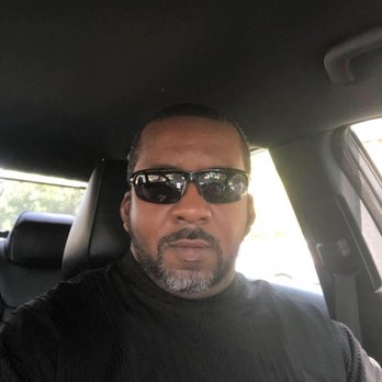 The Gristmill - a man in sunglasses in a car - American Near Me - Clinton, North Carolina