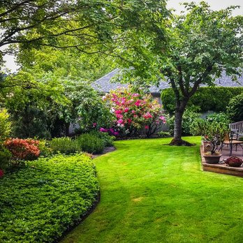 Leo Lion Landscaping & Masonry - a backyard with a deck and lawn - Masonry/Concrete Near Me Leo Lion Landscaping & Masonry - a backyard with a deck and lawn - Masonry/Concrete Near Me