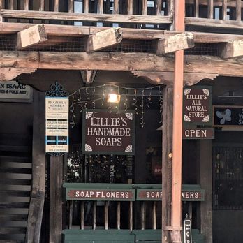 Lillie's Handmade Soap - The entrance to Lillie's Handmade Soaps, which has a painted wooden sign and hanging white Christmas lights - Cosmetics & Beauty Supply Near Me - Albuquerque, New Mexico