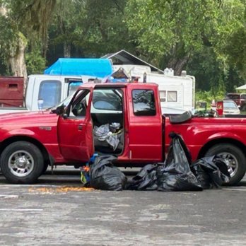 Cindy's Motor Lodge - Garbage in parking lot - Hotels Near Me - Mayo, Florida
