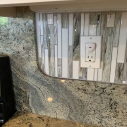 Check out the detail curving around the granite (stove area)