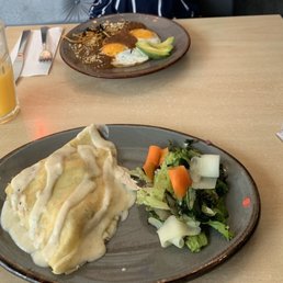 Huevos rancheros and chicken crepe with mushroom Huevos rancheros and chicken crepe with mushroom