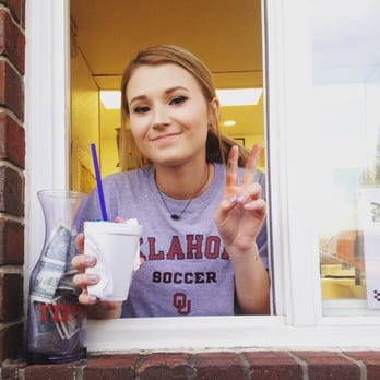 Summer Snow Entertainment - a woman holding up a cup of coffee - Ice Cream & Frozen Yogurt Near Me - Moore, Oklahoma Summer Snow Entertainment - a woman holding up a cup of coffee - Ice Cream & Frozen Yogurt Near Me - Moore, Oklahoma