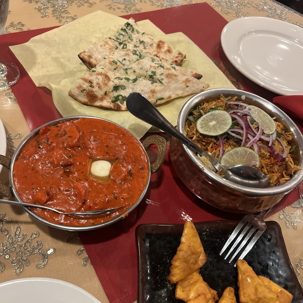 Garlic Naan, Butter Chicken, Chicken Biryani, Paneer Pakoras Garlic Naan, Butter Chicken, Chicken Biryani, Paneer Pakoras