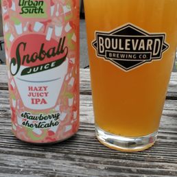 a can and a glass on a table a can and a glass on a table