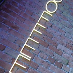 Daily Rise Coffee - Downtown - Neon signs with lots of outdoor lighting.