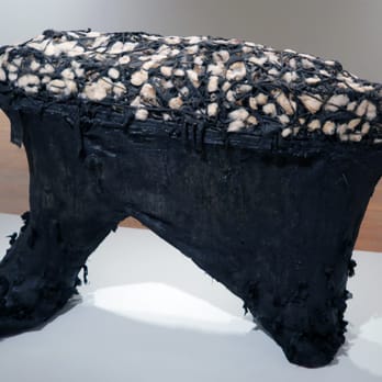 Studio Museum Harlem - Nari Ward; Rolling Calf; 1993; tar, earth, salt, feathers, cotton, cloth, springs, ironing board - Art Museums Near Me - New York, New York Studio Museum Harlem - Nari Ward; Rolling Calf; 1993; tar, earth, salt, feathers, cotton, cloth, springs, ironing board - Art Museums Near Me - New York, New York