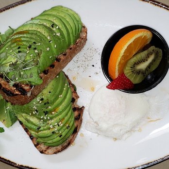 Linn's Restaurant - Avocado toast on multi grain bread, poached egg and fruit. - American Near Me - Cambria, California Linn's Restaurant - Avocado toast on multi grain bread, poached egg and fruit. - American Near Me - Cambria, California