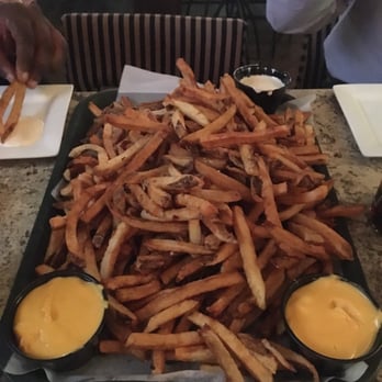 Local Whiskey - A tray of fresh cut fries, beware this could feed an army! Very good. - Cocktail Bars Near Me - State College, Pennsylvania