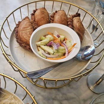 Osha Thai Express - $13 thai samosa: fried mashed potato w/ curry powder and onion, side of fresh tangy cucumber salad - Thai Near Me - Oakland, California