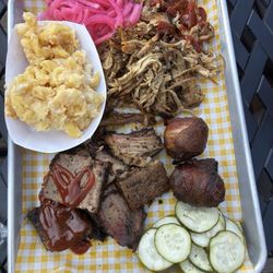 BBQ Underground - You choose your 2 meats and 2 sides, pickled onions and pickles are complimentary.