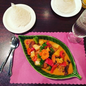 Thai Basil - Crispy duck curry! Lovely vegetables and a carrot flower - Thai Near Me - Ithaca, New York