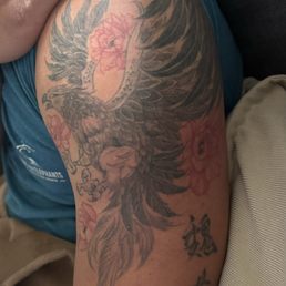 Roc Bird with Chinese characters and red flowers integrated in Roc Bird with Chinese characters and red flowers integrated in