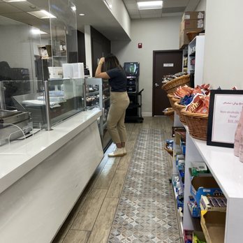 Fresco Café - a woman standing at the counter - Cafes Near Me - Miami Beach, Florida Fresco Café - a woman standing at the counter - Cafes Near Me - Miami Beach, Florida