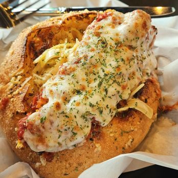 Petali - Fettuccine Alfredo with chicken parmesan in a bread bowl - Italian Near Me - Rancho Cordova, California Petali - Fettuccine Alfredo with chicken parmesan in a bread bowl - Italian Near Me - Rancho Cordova, California