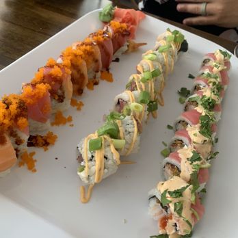 The Slippery Mermaid - Poseidon roll (orange) Raider roll (center) Sexy Mermaid (left) - Sushi Bars Near Me - Navarre, Florida The Slippery Mermaid - Poseidon roll (orange) Raider roll (center) Sexy Mermaid (left) - Sushi Bars Near Me - Navarre, Florida