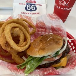 Double garlic butter cheeseburger, onion rings, Coca Cola. Double garlic butter cheeseburger, onion rings, Coca Cola.