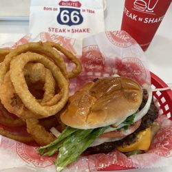 Steak ’n Shake - Double garlic butter cheeseburger, onion rings, Coca Cola.