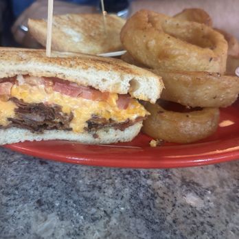 Benchmark Sports Pub & Eatery - BPT with onion rings - Sports Bars Near Me - Franklin, Tennessee Benchmark Sports Pub & Eatery - BPT with onion rings - Sports Bars Near Me - Franklin, Tennessee