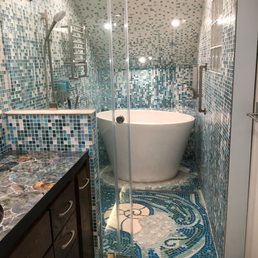 Terazzo Japanese soaking tub, custom glass mosaics, custom glass shower door.