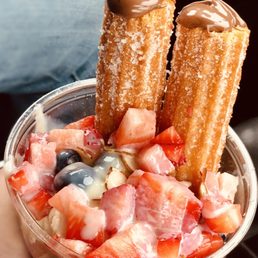 Very berry churro sundae topped with lechera-filling is Nutella.