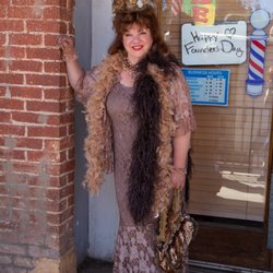 Eldon's Barber Shop - Betty poses in front of the Eldon's Barber Shop which she owns.