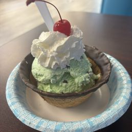 Mint chocolate chip ice cream in a chocolate dipped waffle bowl w/ whip cream Mint chocolate chip ice cream in a chocolate dipped waffle bowl w/ whip cream