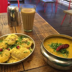 Chit Chaat Chai - Yogurt puri on the left, tarka dhaal on the right and masala chai in the background