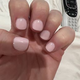 2 hours post manicure... what shape is this? I asked for square... Disgusting cuticles, and two places where she cut my skin...