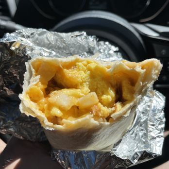 Stage Stop - Breakfast Burrito torn open after a few bites. Delicious! - Ice Cream & Frozen Yogurt Near Me - Westcliffe, Colorado Stage Stop - Breakfast Burrito torn open after a few bites. Delicious! - Ice Cream & Frozen Yogurt Near Me - Westcliffe, Colorado